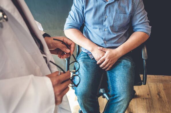 a man with prostatitis symptoms at a doctor's appointment
